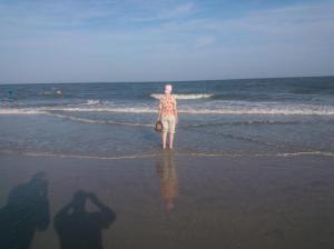 Carrie standing in the surf